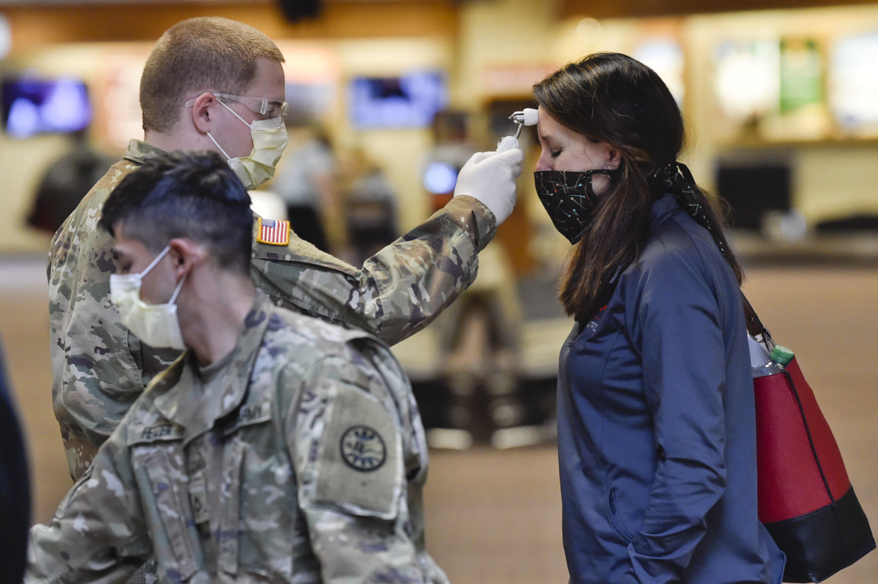 Montana National Guard soldiers screen passengers